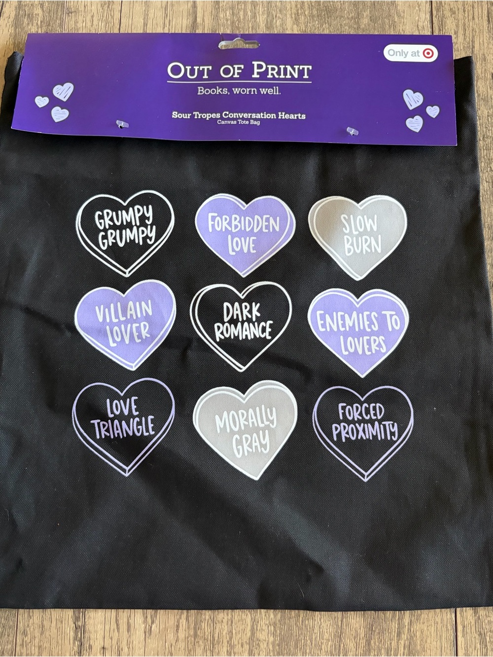 Out of Print Black Tote Bag with Purple and Gray Conversation Hearts